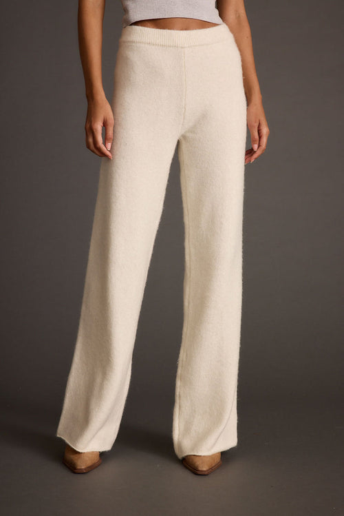 Ivory sweater with refined detailing and a flattering silhouette.