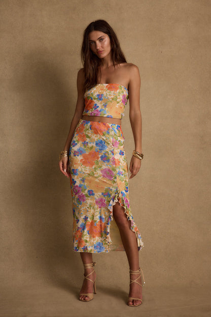 Back view of the floral mesh crop top showing the silhouette and fit.