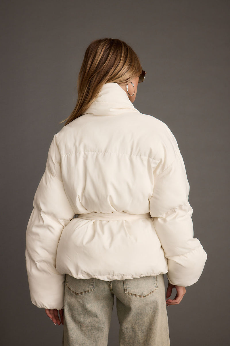 Back view of the white jacket showing the silhouette and fit.