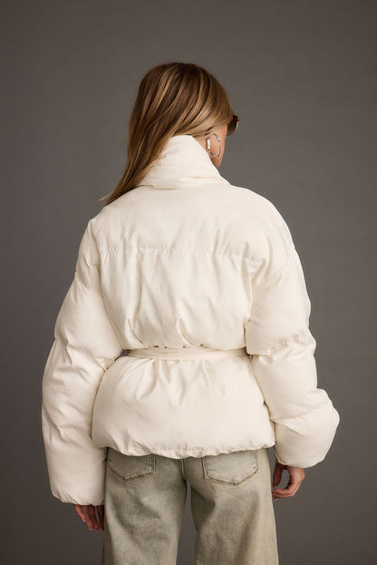 Back view of the white jacket showing the silhouette and fit.