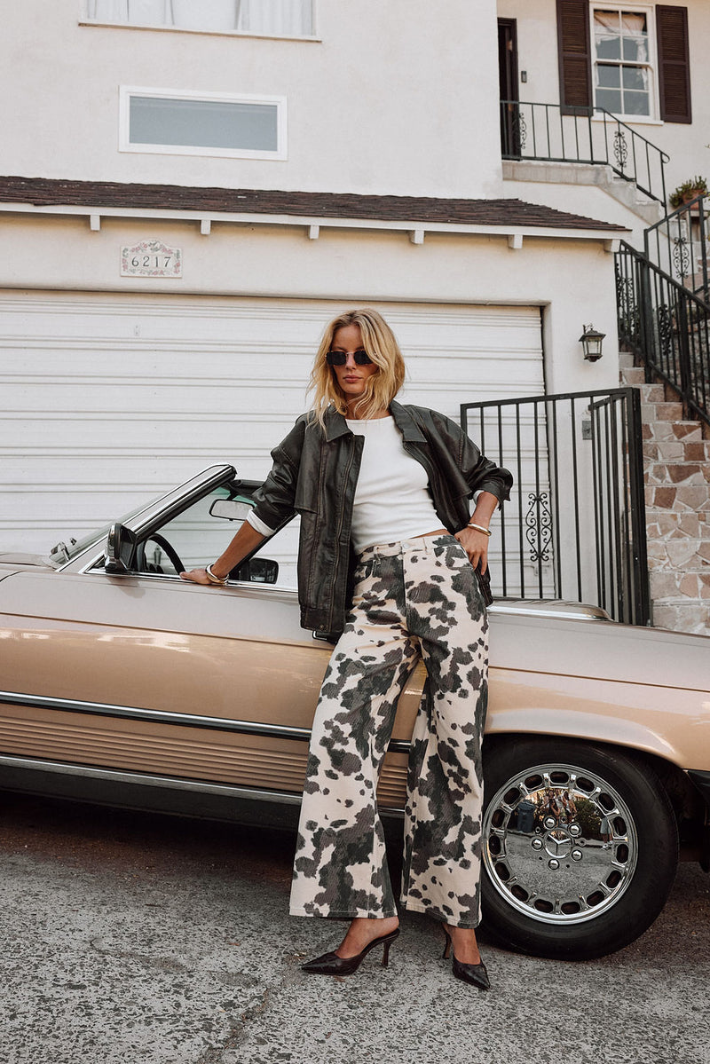 Pants with elegant accents, a cow print pants standout.