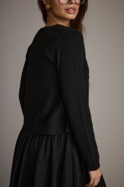 Mindy Black Crew Neck Cardigan shown in a complementary styling arrangement.