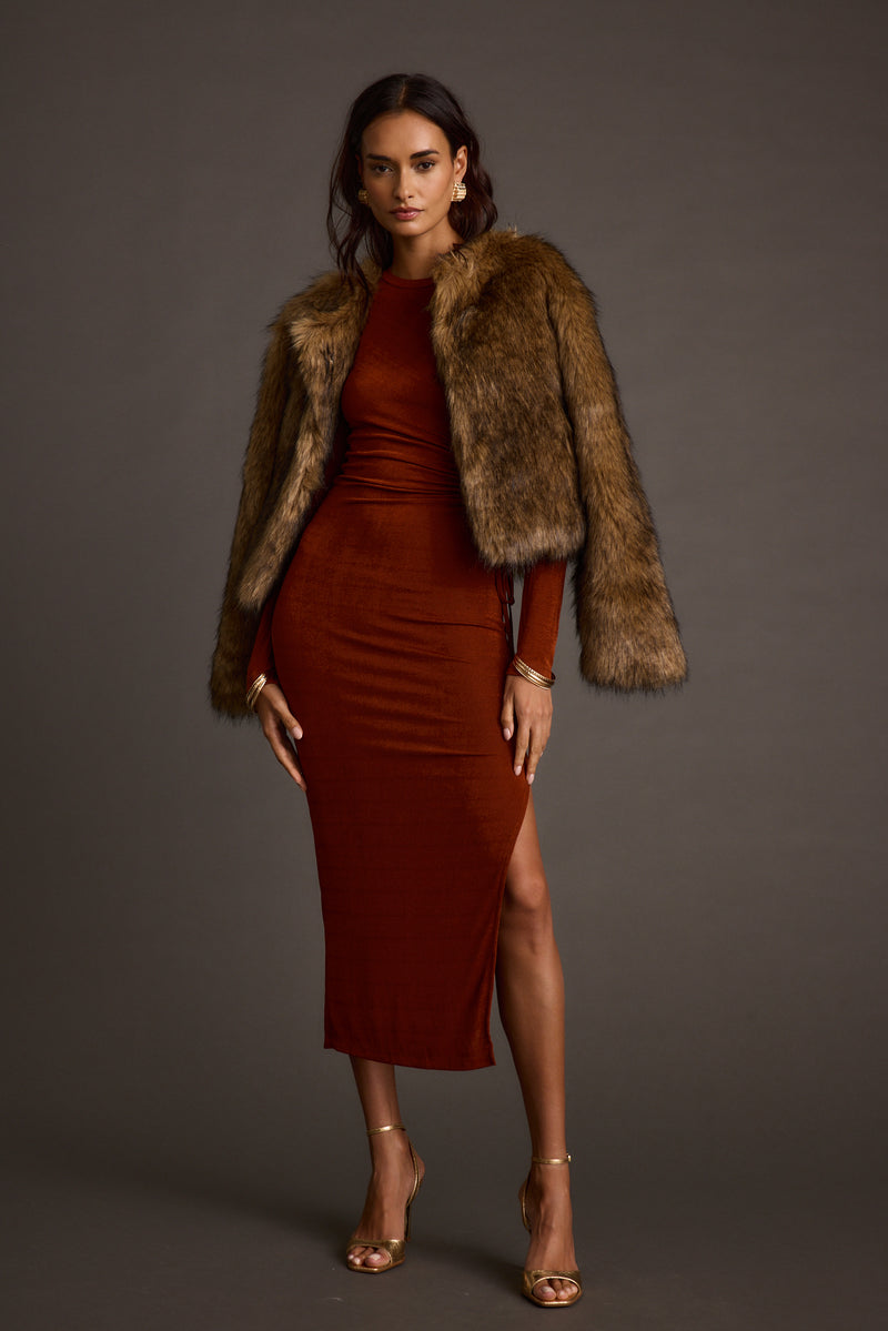 Back view of the brown faux fur jacket showing the silhouette and fit.
