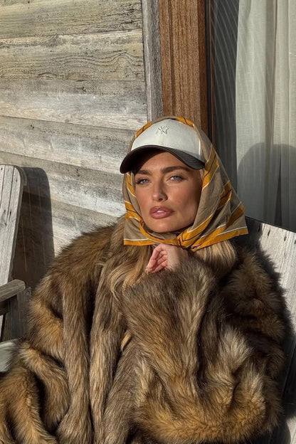 Close-up of the Misty Brown Faux Fur Coat showcasing the faux fur texture and craftsmanship.