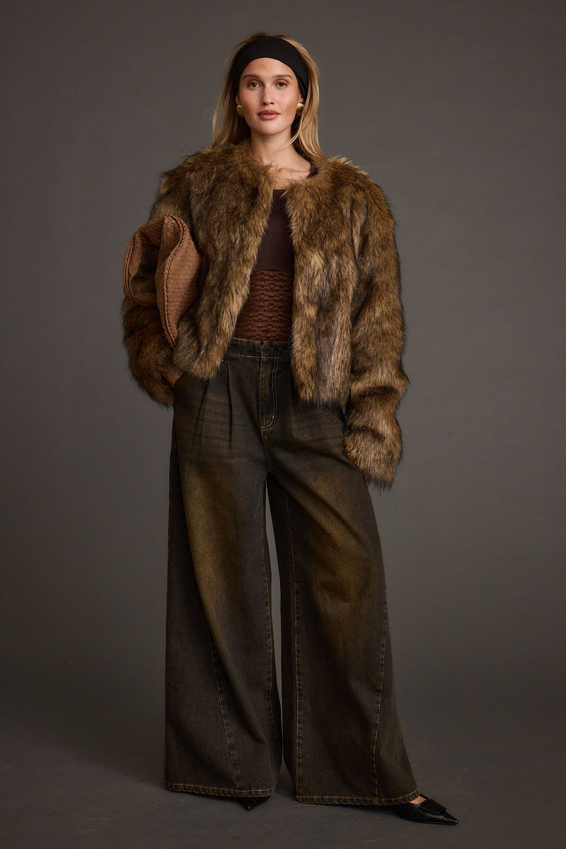 Lifestyle shot of the brown jacket styled for day-to-night versatility.