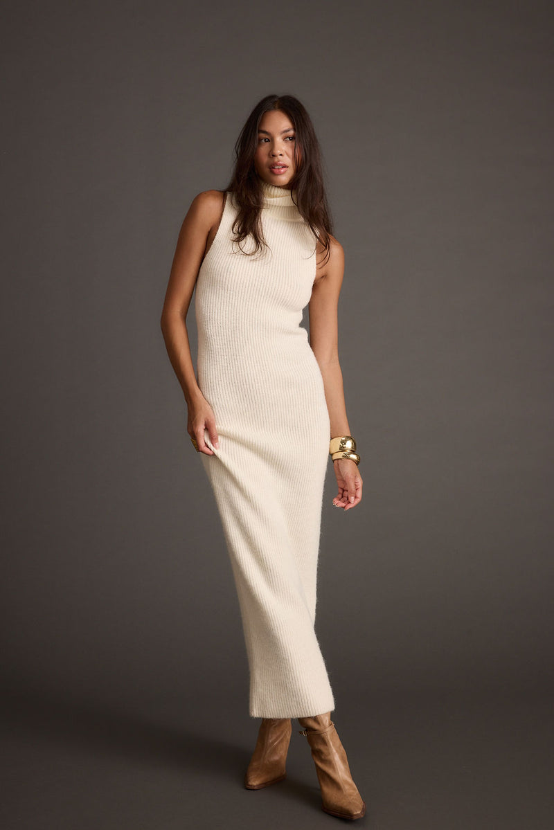 Cream maxi dress with elegant accents, a vacation maxi dress essential.