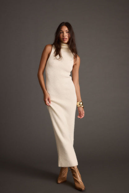 Cream maxi dress with elegant accents, a vacation maxi dress essential.