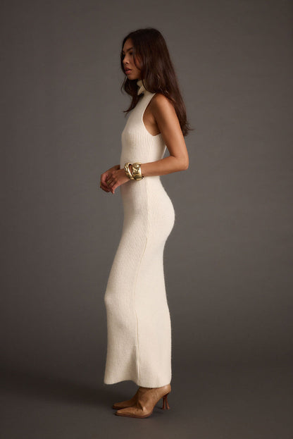 Back view of the cream maxi dress showing the silhouette and fit.