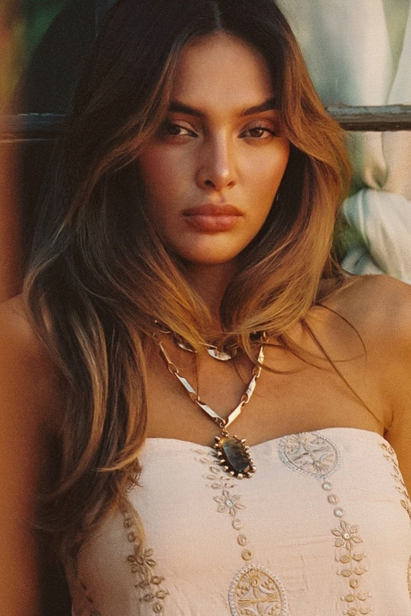 Moonbeam Gold Statement Necklace styled in a complete look from an alternate angle.
