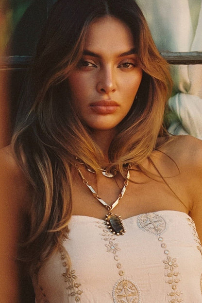 Moonbeam Gold Statement Necklace styled in a complete look from an alternate angle.