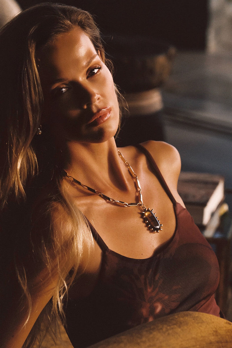 Moonbeam Gold Statement Necklace paired with complementary accessories for a polished look.