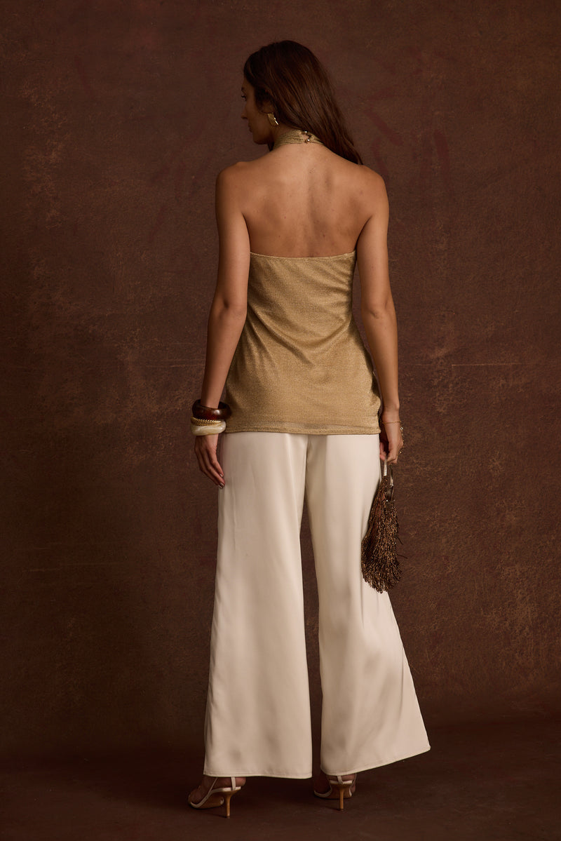 Moonlit Kiss Gold Lurex Halter Top paired with complementary accessories for a polished look.