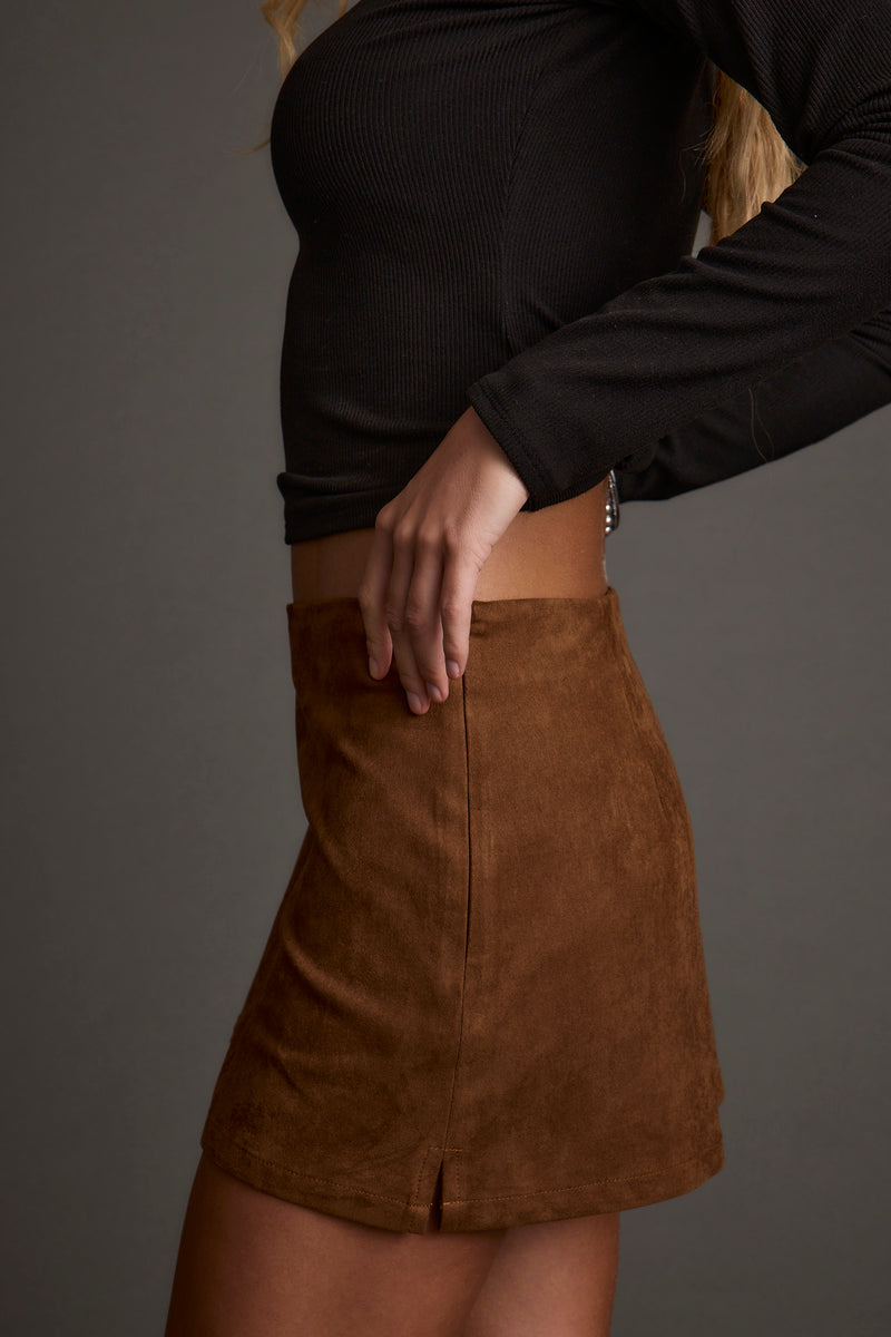 Moxie Cognac Vegan Suede Mini Skirt paired with complementary accessories for a polished look.