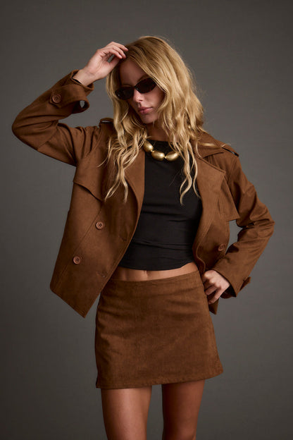 Moxie Cognac Vegan Suede Mini Skirt shown in a complementary styling arrangement.