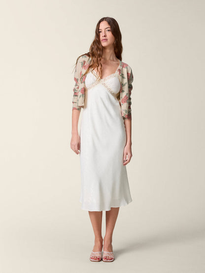 Front view of the white Jenna dress worn with the Albira cardigan.