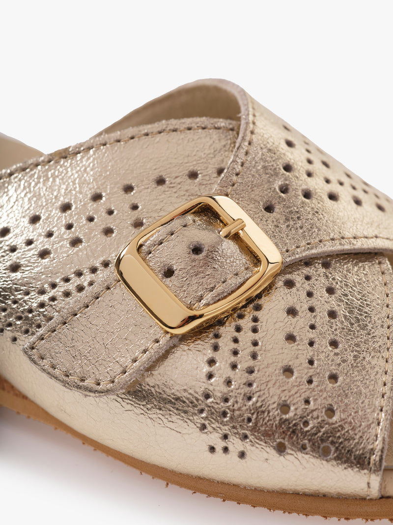 Close-up shot of the strap and buckle details on the JACQUELINE silver leather mule shoes