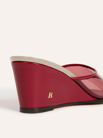 NATTY burgundy vinyl wedge mules, back view showing R logo by Rouje
