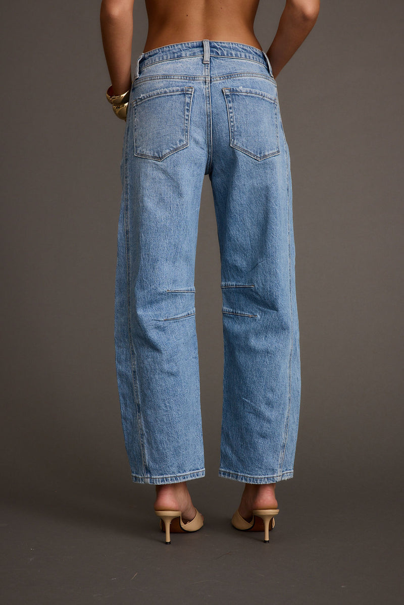 Back view of the denim jeans showing the silhouette and fit.