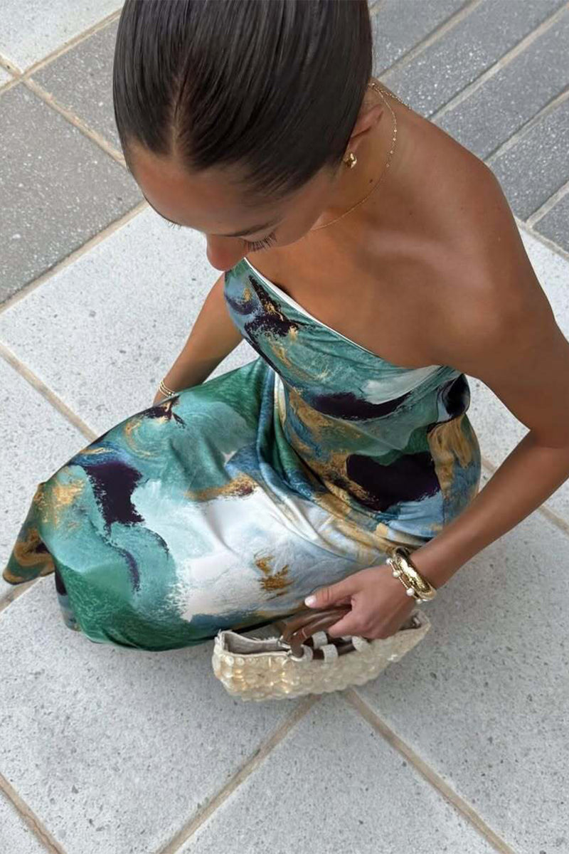 Full-length view of the blue maxi dress showing the drape and movement.