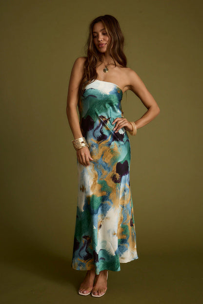 Natalia Blue and Gold Watercolor Strapless Maxi Dress paired with complementary accessories for a polished look.