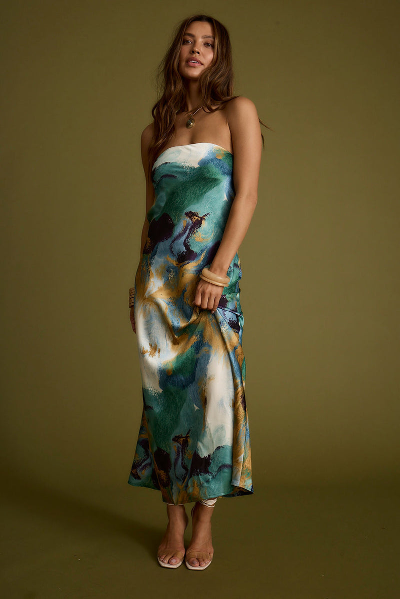 Lifestyle shot of the blue maxi dress styled for day-to-night versatility.