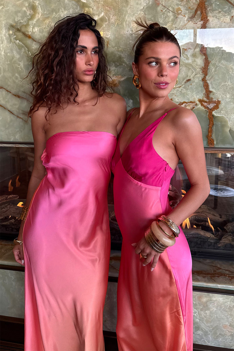 Lifestyle shot of the pink maxi dress styled for day-to-night versatility.