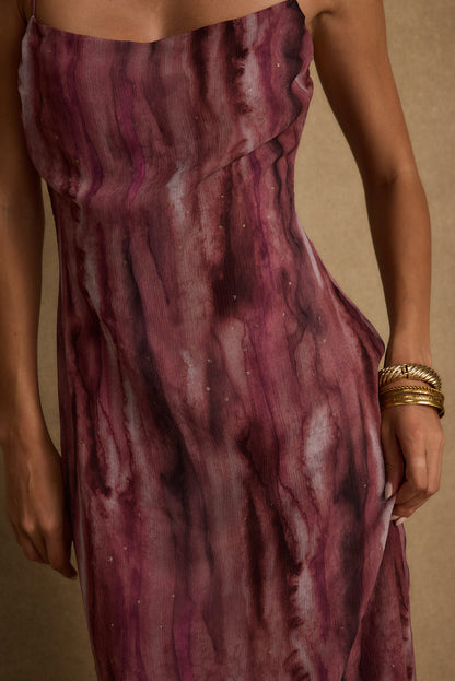 Full-length view of the berry maxi dress showing the drape and movement.