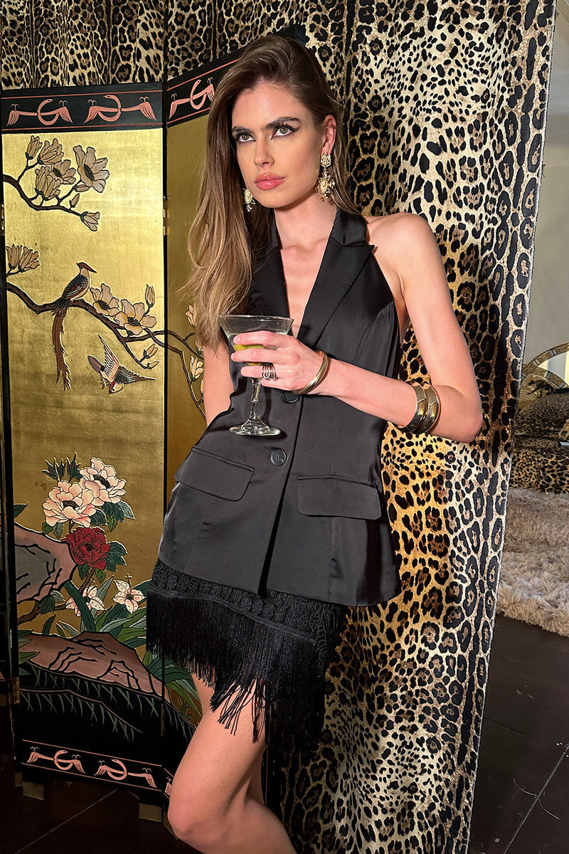 Back view of the black satin vest showing the silhouette and fit.
