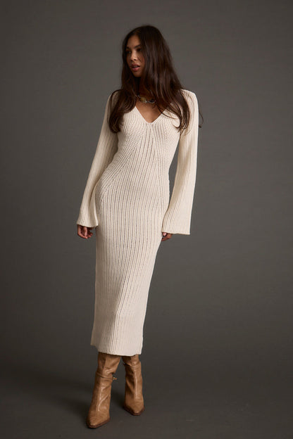 Cream sweater dress with elegant accents, a cream mini dress essential.