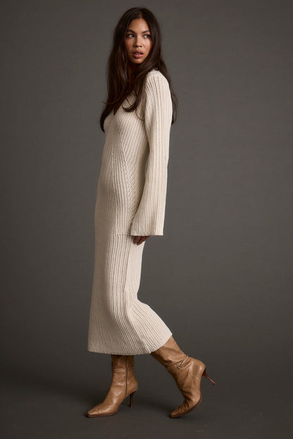 Detail shot of the Nolita Cream Midi Sweater Dress highlighting the design elements.