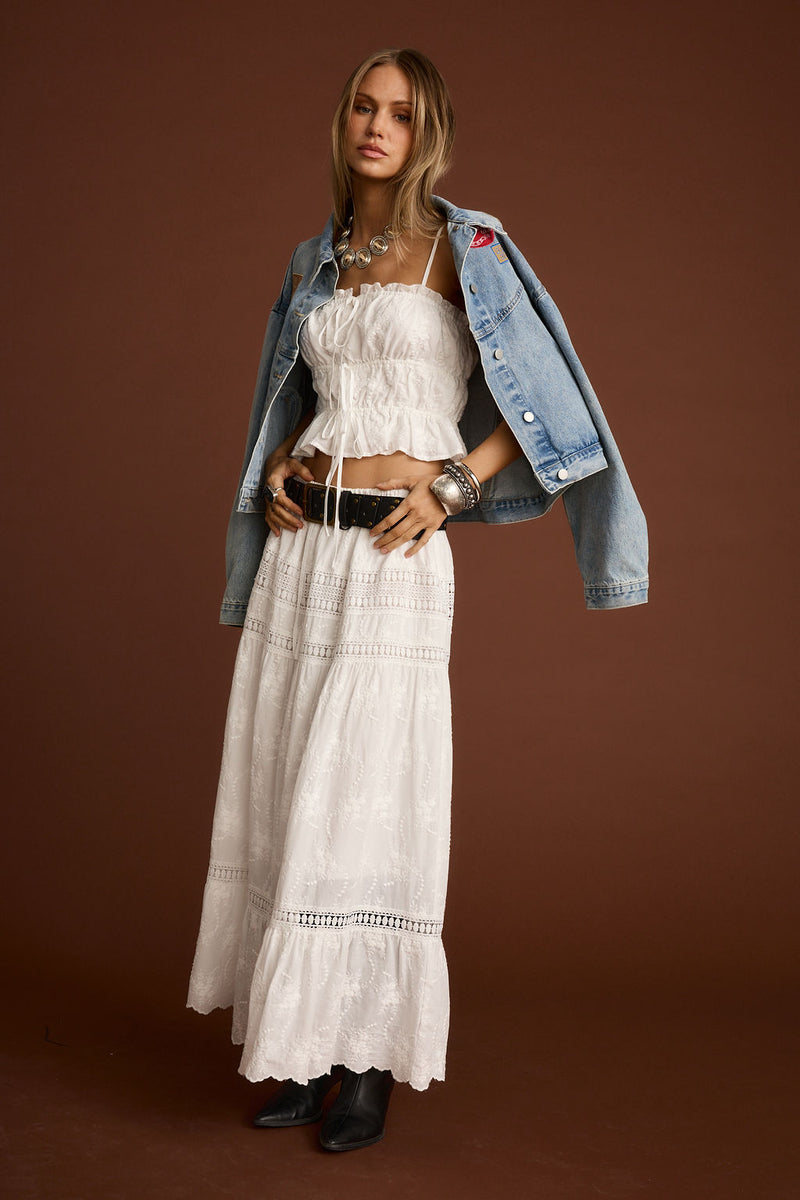 Detail shot of the Nomad White Embroidered Maxi Skirt highlighting the embroidered elements.