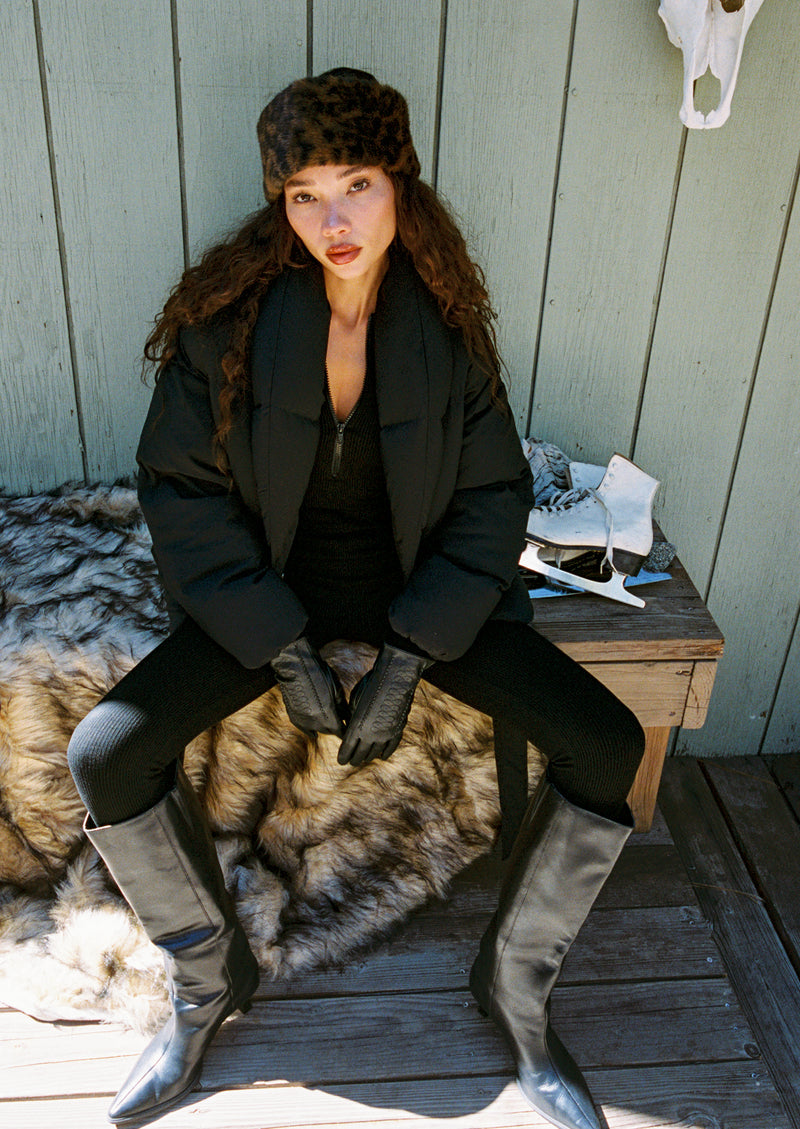 Nordic Black Ribbed Jumpsuit shown in a complementary styling arrangement.
