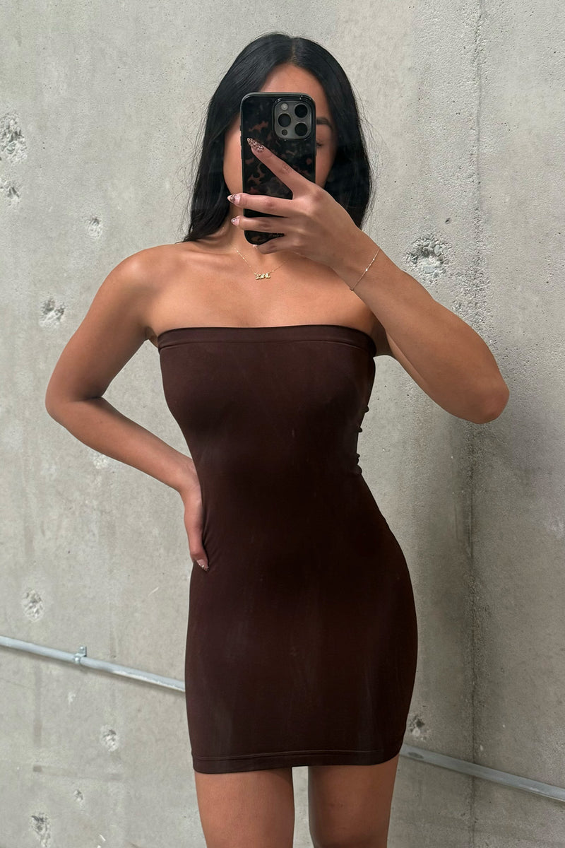 Brown strapless dress with elegant accents, a brown satin dress essential.