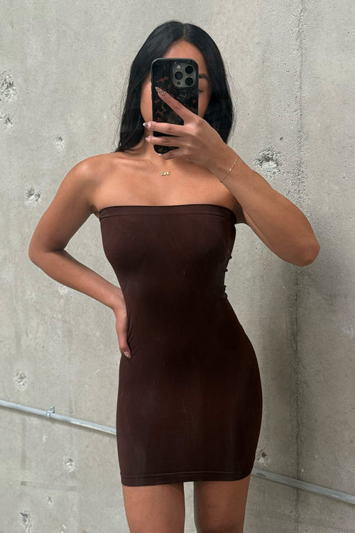 Brown strapless dress with elegant accents, a brown satin dress essential.
