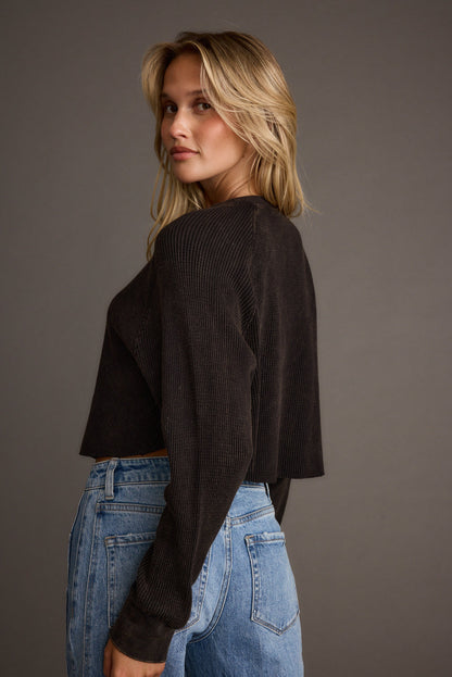 Detail shot of the Not Your Boyfriend Washed Black Waffle Knit Henley highlighting the knit elements.