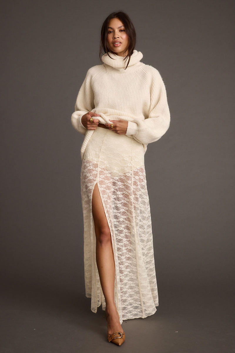 White lace maxi skirt with refined accents, a white lace skirt essential.