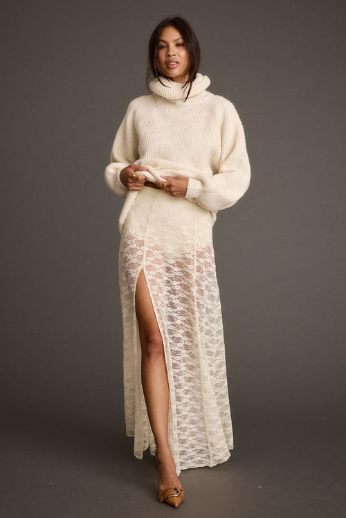 White lace maxi skirt with refined accents, a white lace skirt essential.