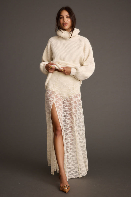 White lace maxi skirt with refined accents, a white lace skirt essential.