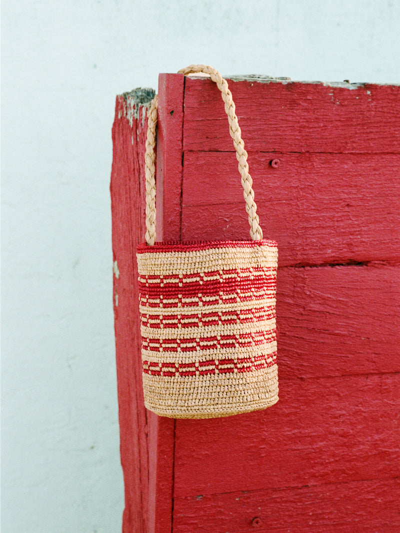MARTINO beige raffia basket bag worn on a model by Rouje