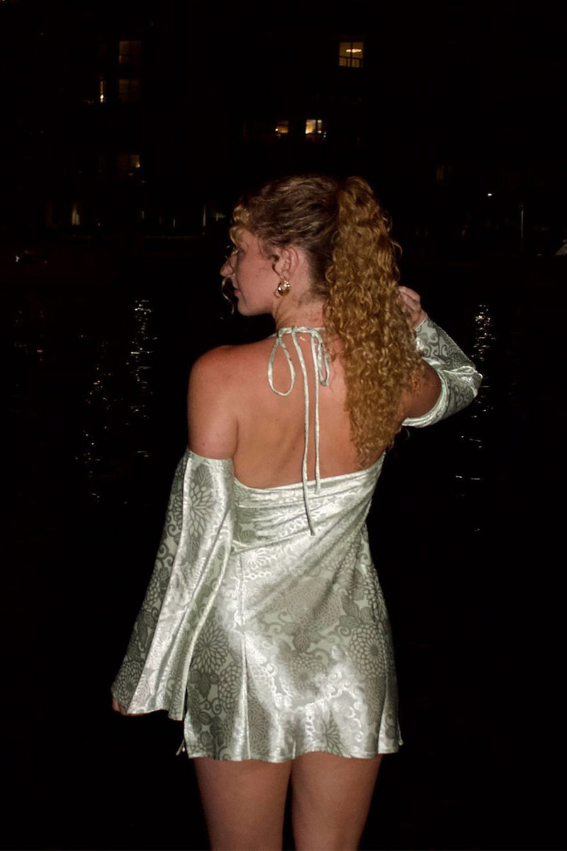 Pearlina Sage Printed Satin Mini Dress styled in a complete look from an alternate angle.