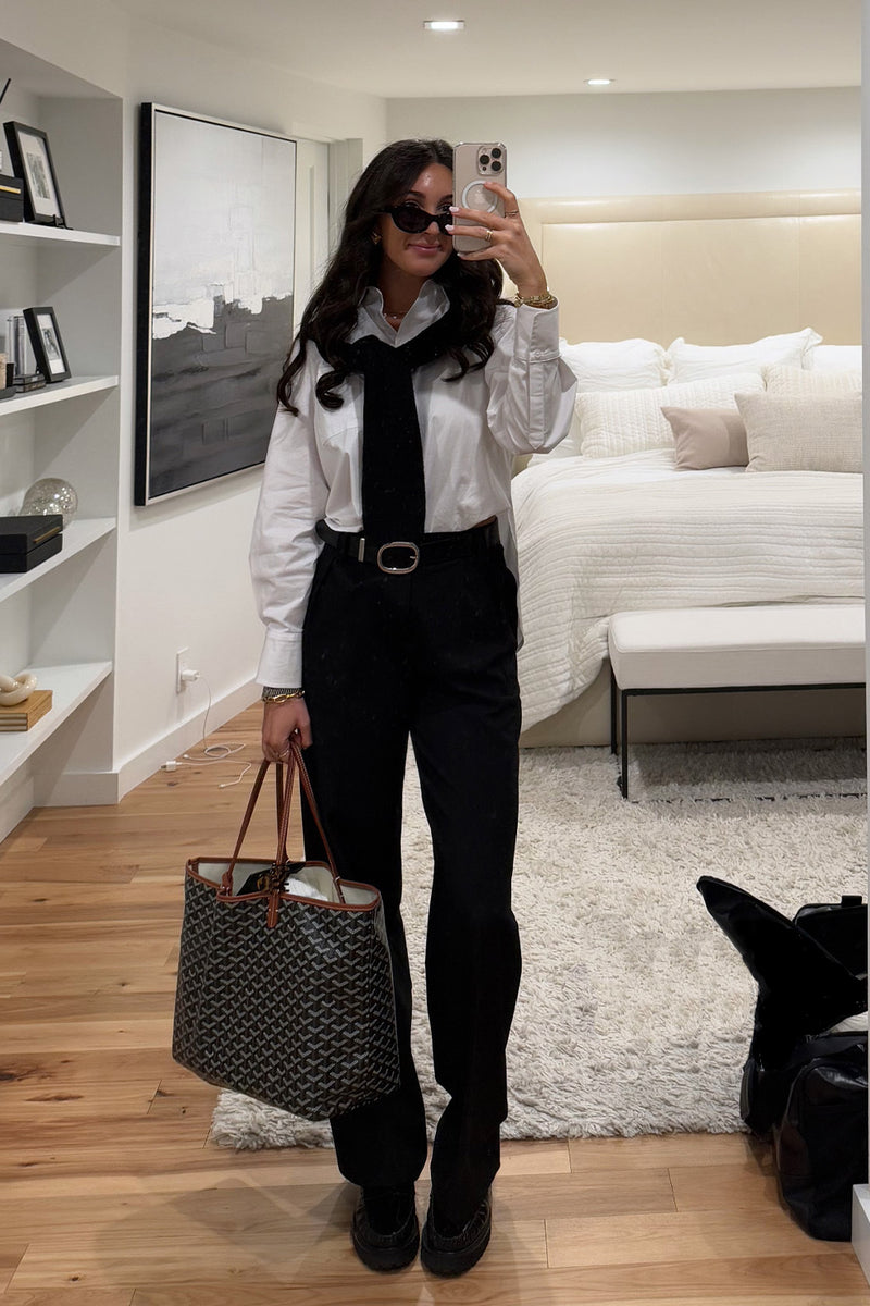 White pants with refined detailing and a flattering silhouette.