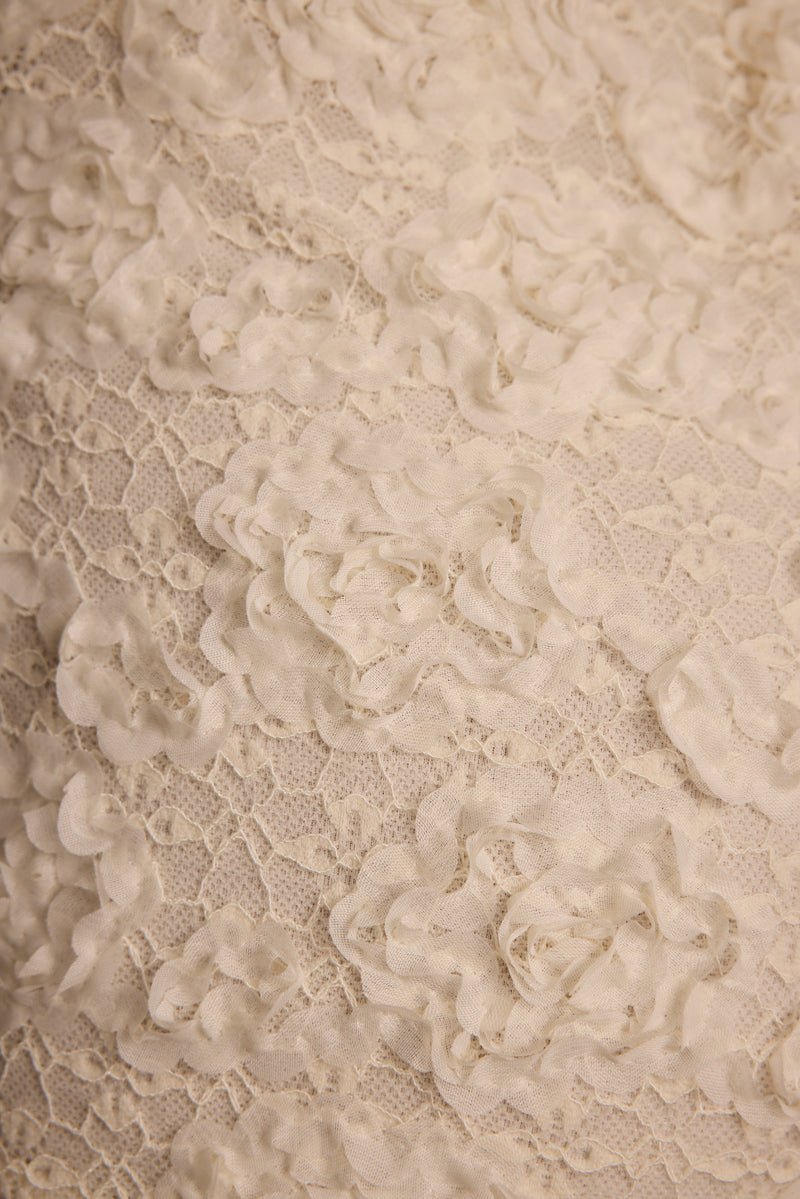 Alternate angle of the ivory shorts highlighting the overall design.
