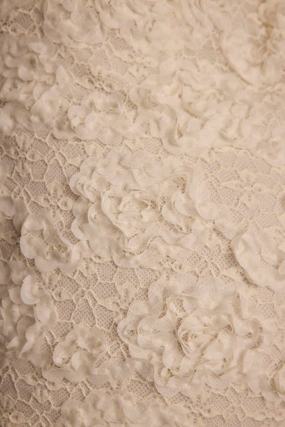 Alternate angle of the ivory shorts highlighting the overall design.