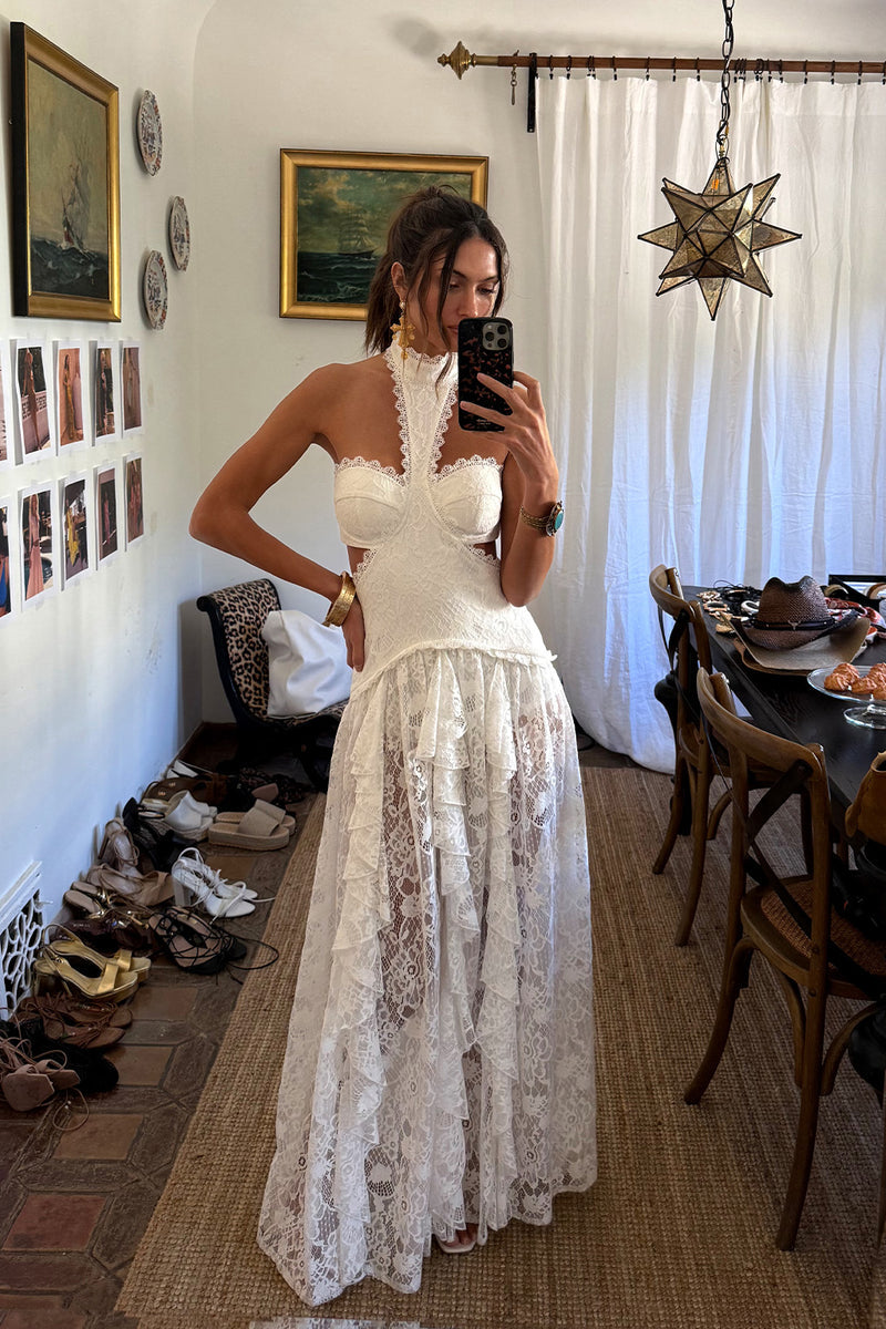 Back view of the white lace maxi dress showing the silhouette and fit.