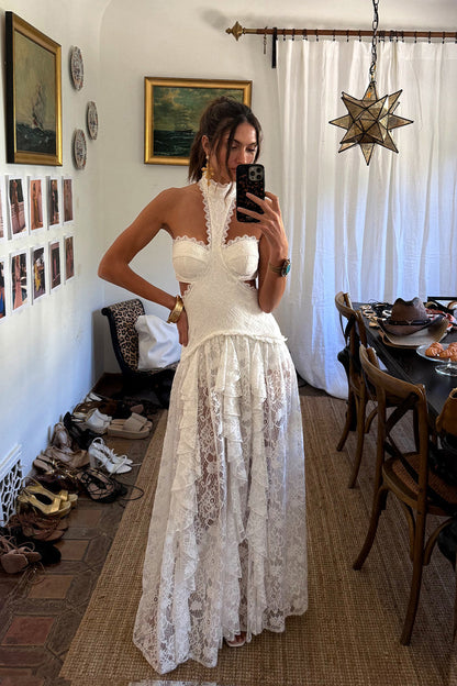 Back view of the white lace maxi dress showing the silhouette and fit.