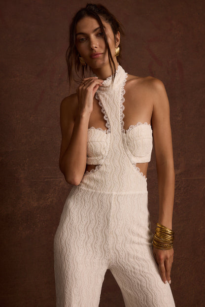 Close-up of the Princesa White Lace Jumpsuit showcasing the lace texture and craftsmanship.