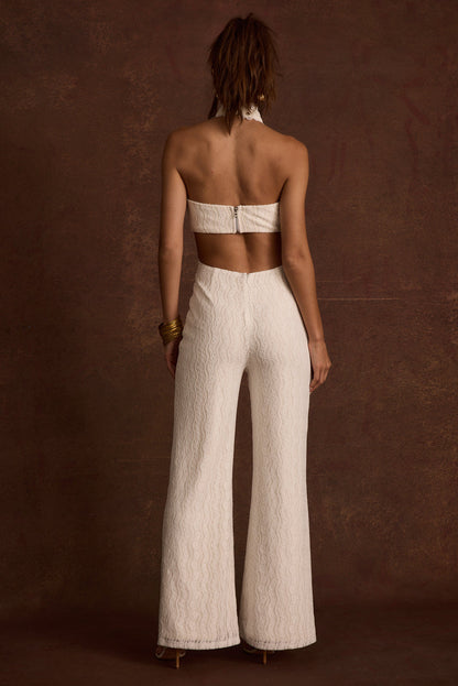 Princesa White Lace Jumpsuit paired with complementary accessories for a polished look.