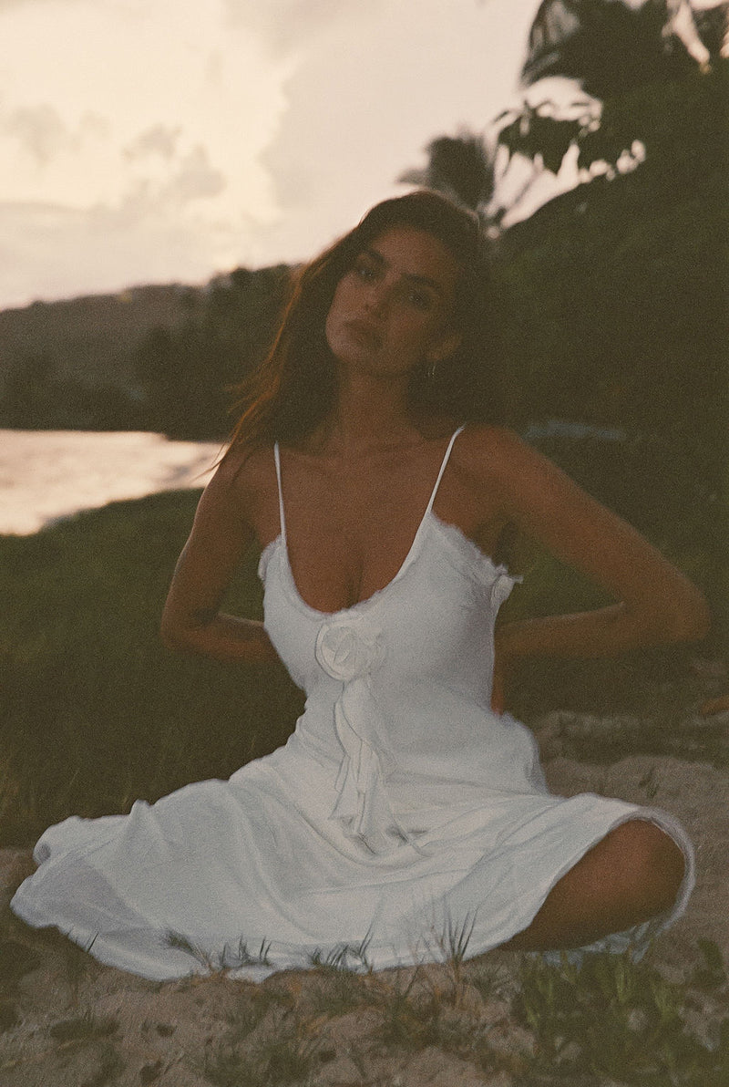 Close-up of the Prosecco White Rosette Frill Maxi Dress showcasing the fabric texture and design details.