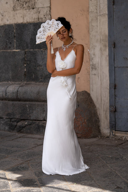 Detail shot of the Prosecco White Rosette Frill Maxi Dress highlighting the design elements.