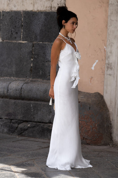 Lifestyle shot of the white maxi dress styled for day-to-night versatility.